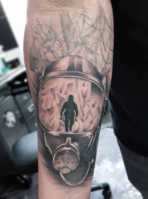 Realism fireman helmet tattoo by @julian.ink_tattooartist