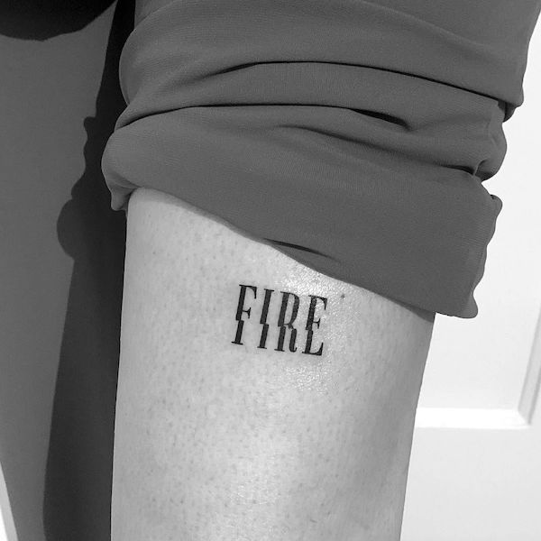 Fire one word tattoo by @jila.tattoo