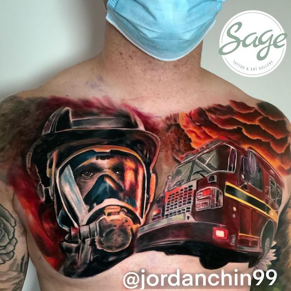Firefighter and fire truck chest tattoo by @sagetattoogallery
