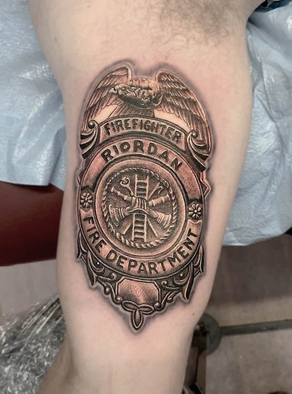 Firefighter badge tattoo by @harleyheumann