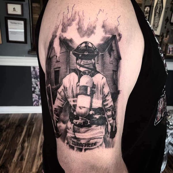 Realism firefighter tattoo by @studio617
