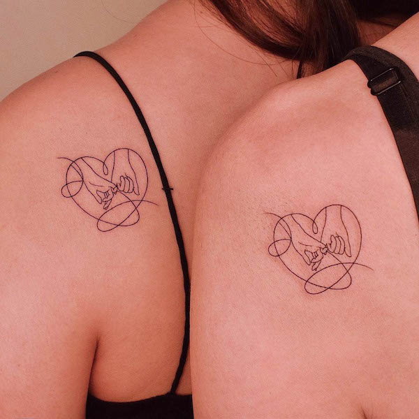 Matching heart fine line tattoos by @tattooer_jina