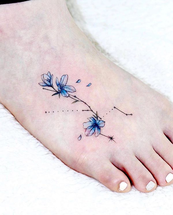 Floral foot tattoo by @aeri_tattoo
