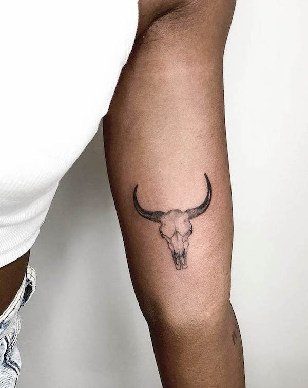 Bull skull bicep tattoo by @tattoobyemre_
