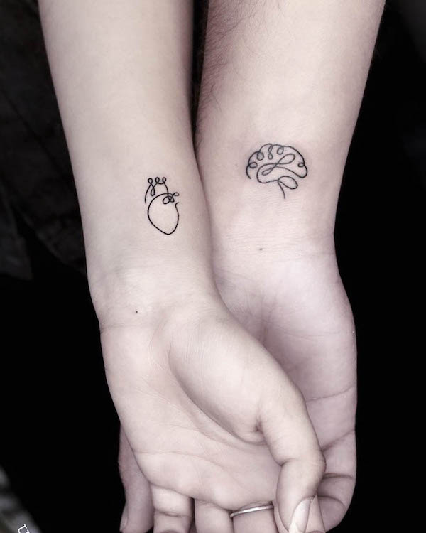 Tatuajes de corazón y cerebro a juego de @blue_heaven_tattooz