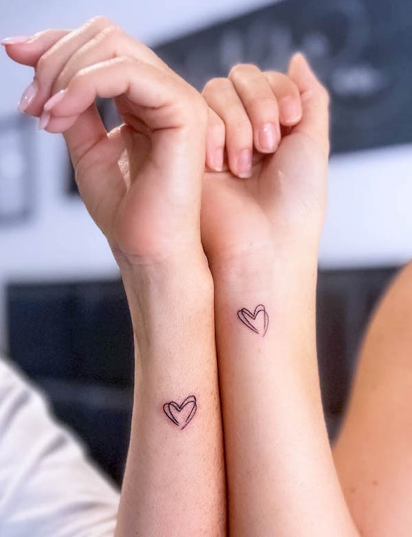 Double hearts mother daughter tattoos by @inkredibletattoos
