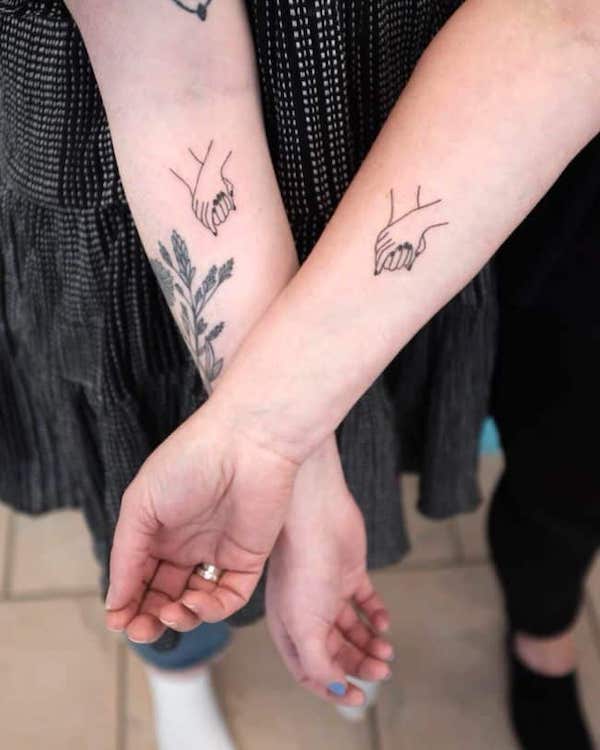 Cute holding hands tattoos by @bim.tattoo