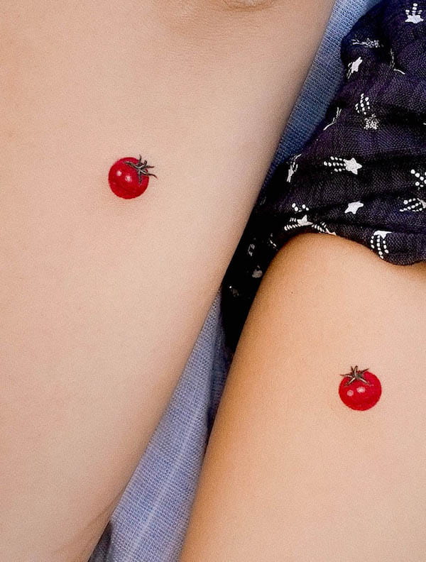 Tiny tomato matching tattoos for mother and daughter by @0chicken.tattoo
