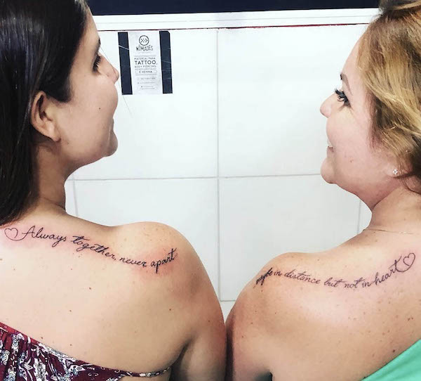 Matching quote tattoos on the shoulder by @gabriellacjohnson