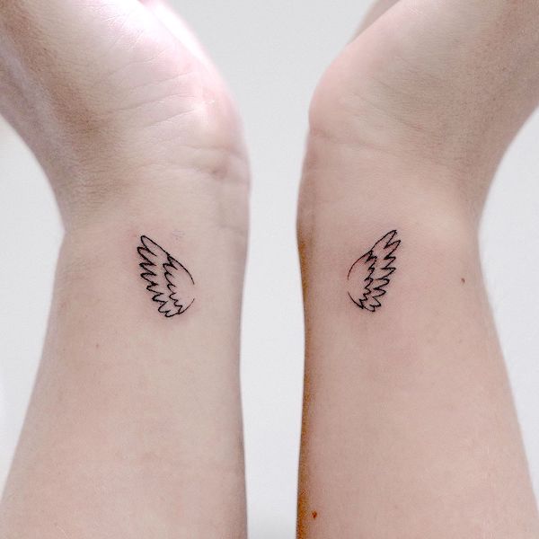 Angel wings wrist tattoos by @halona.ink_