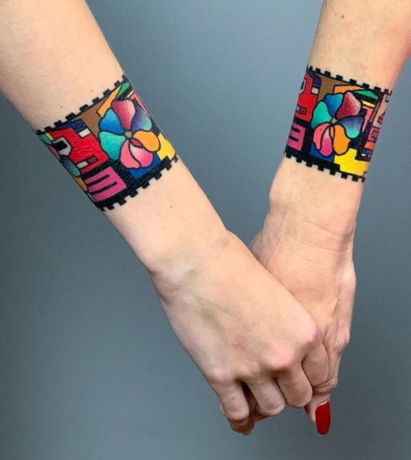 Colorful wrist band tattoos by @imrichkovacs- Wrap around bracelet tattoo ideas 