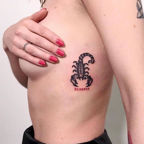 A dual-colored tattoo on the ribs by @rozalie_tetuje - Scorpio tattoos for women that are pure dark aesthetics