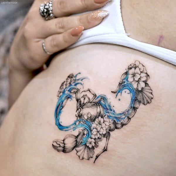 An Aquarius-Scorpio watercolor tattoo by @ladvtattoos - Scorpio tattoos for women that are pure dark aesthetics