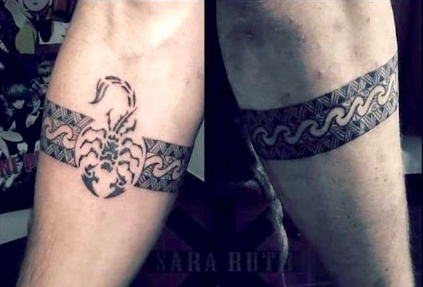 A tribal scorpion tattoo by @sara.ruth_.tattoo
